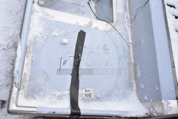 Brand new Regency 600DDTS384RT dish table with 3-compartment sink, scratch and dent. Features right drainboard, snow-covered.