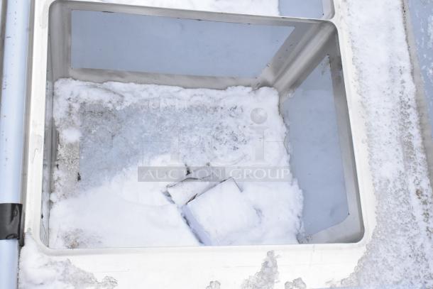 Regency 7' soiled dish table with 3-compartment sink, visible snow and dirt. 16-gauge steel, right drainboard, minor dents.