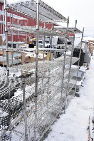 Two chrome finish wire shelves, multi-tiered, in excellent condition, suitable for storage or display, outdoor setting.