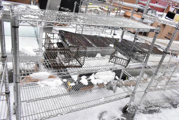 Chrome finish 3 tier wire shelf with commercial casters, snow-covered surface, metal frame, buyer dismantle required.