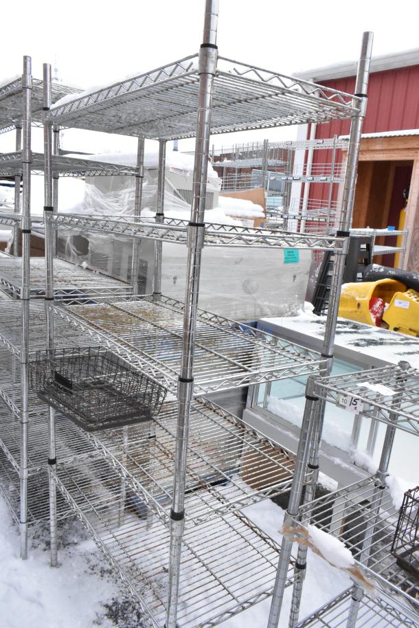 Two chrome finish wire shelves, outdoor setting, snow-covered, buyer must dismantle. Consider freight charges.