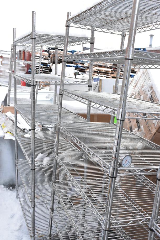 Two chrome finish wire shelves, in good condition, outdoor setting. Dismantling and freight required for buyers.