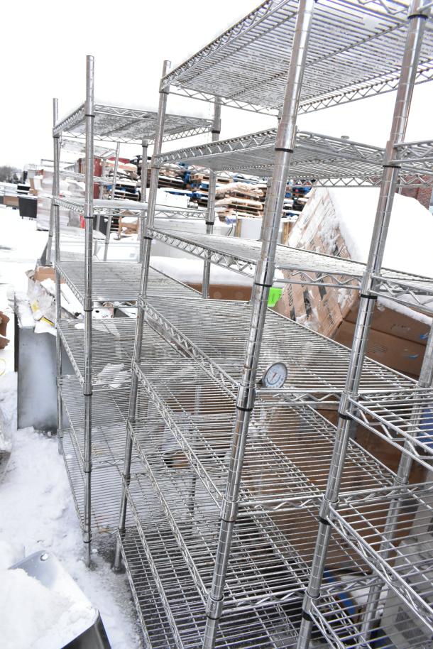 Chrome finish wire shelves in used condition, requiring dismantling. Auction includes two units; buyer arranges freight.