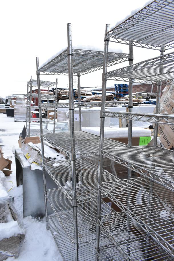 Two chrome finish wire shelves in outdoor setting, snow-covered. Good condition. Buyer must dismantle; freight not included.