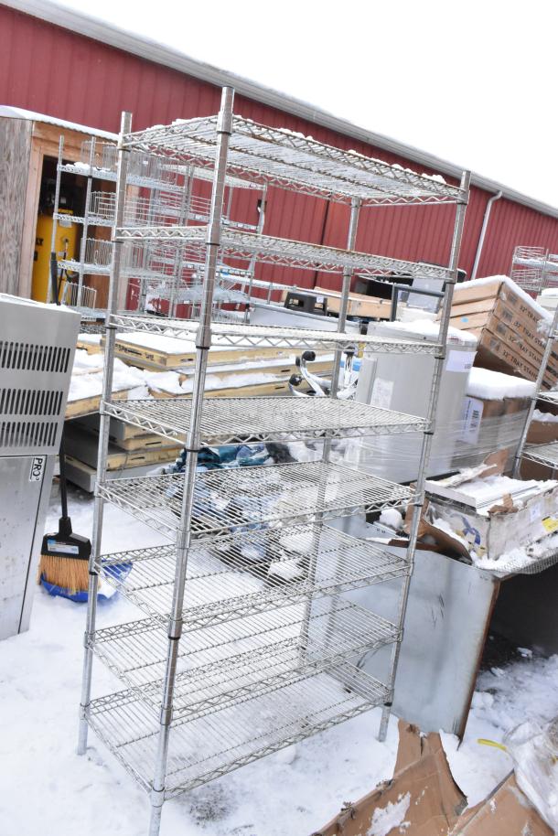 Chrome finish 8-tier wire shelving unit in used condition. Buyer must dismantle; consider freight charges.