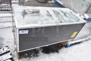 Merchandise display case, glass top, aluminum frame, snowy condition, label shows item number 340.