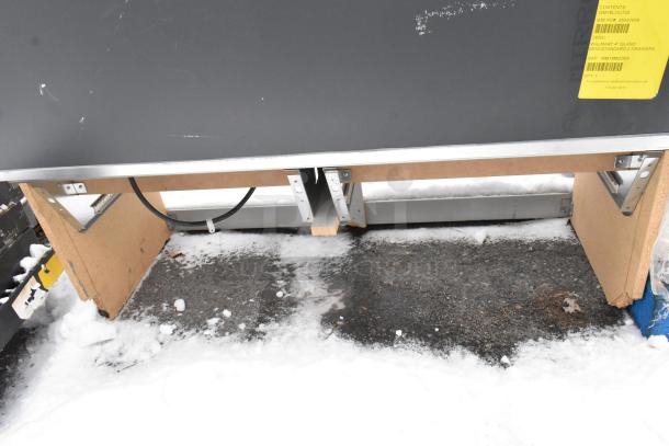 Merchandise display case with metal frame, labeled for Walmart, features two drawers. Some wear visible on surface.