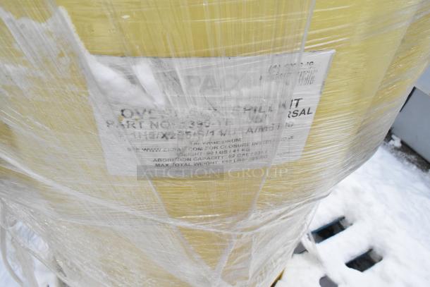 Yellow spill kit barrel wrapped in plastic, part number visible, max weight 650 lbs, on a snowy pallet.