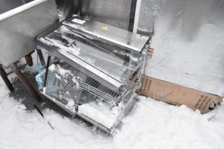 ServIt 423HDM26SA 26" heated display case, 3 shelves, sliding doors, glass damage, 120V, 1 phase, in snowy setting.