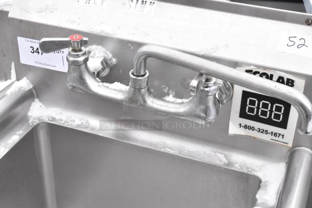 Stainless steel single bay sink with faucet and handles, good condition, visible Ecolab label and auction tag.