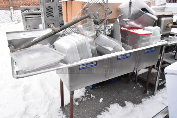 Stainless steel 3 bay sink with left side drain board, includes poly bins. Visible labels: "Sanitize," "Rinse," "Wash."