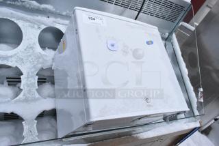 EdgeStar CMF151L Mini Freezer, 115 Volts, 1 Phase. Appears in used condition with visible snow and exterior wear.