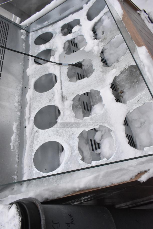 2023 Borgen Systems RR80-6957 metal commercial merchandiser. Horizontal design with insert slots. Snow-covered. 220 volts.