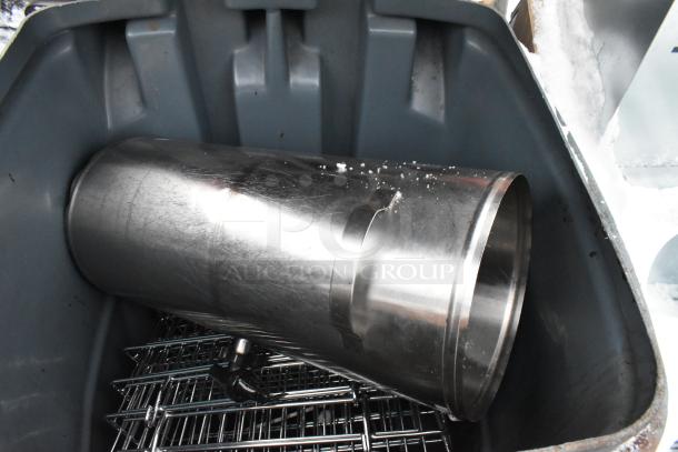 Poly trash can with metal contents, including a fan component, in fair condition. Auction item: bid multiplier applies.