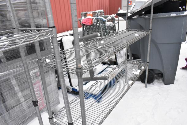 Chrome finish 4-tier wire shelving unit with poly bins. Buyer must dismantle. Snow-covered, outside storage.
