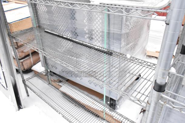 Chrome finish 4-tier wire shelving unit with sink contents. Buyer must dismantle. Consider freight charges.