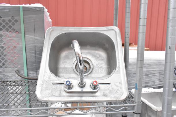 Chrome finish 4-tier wire shelving unit with integrated sink, including contents. Buyer must dismantle. Consider freight.