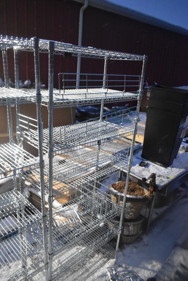 Two chrome finish wire shelving units, multiple shelves, sturdy design. Buyer must dismantle. Consider freight charges.