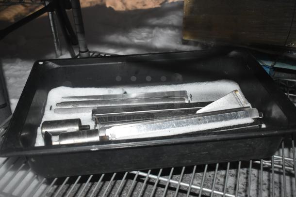 Chrome finish 2-tier wire shelving unit, includes contents like mop bucket. Buyer must dismantle, consider freight charges.