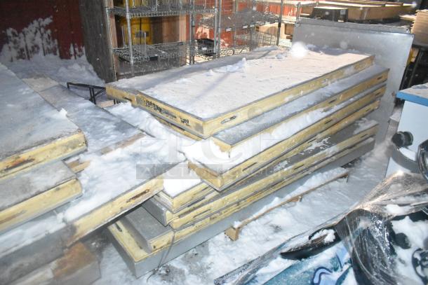 Self-contained walk-in box panels stacked, showing snow and storage condition. Includes PTN047M6BE compressor, 208-230V, 1 phase.