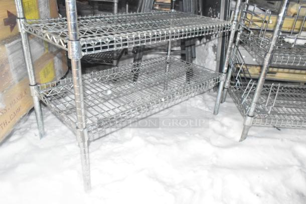 Two chrome wire shelving units with three tiers each, sturdy condition. Buyer must dismantle for shipping.
