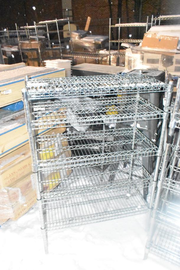 Chrome finish 4-tier wire shelving unit, sturdy construction, buyer must dismantle, ideal for storage, consider freight.