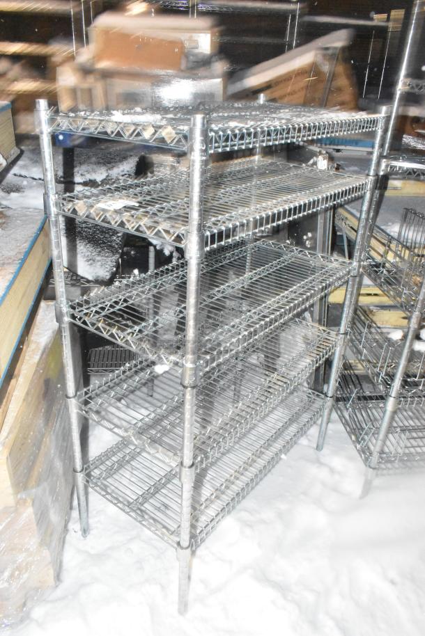 Chrome finish 4 tier wire shelving unit in good condition. Buyer must dismantle for transport. Consider freight charges.