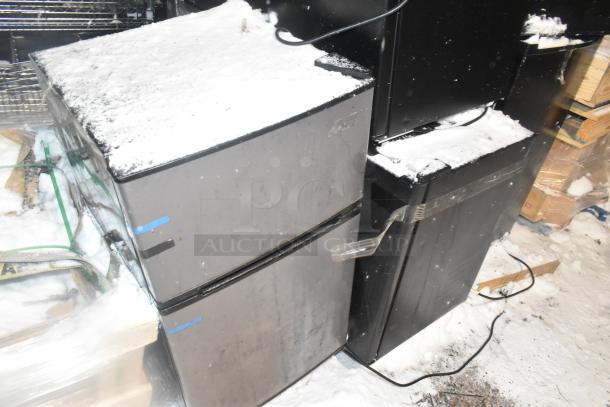 10 mini coolers, brands include Arctic King and Haier, shown outdoors with snow. 115 volts, 1 phase. Signs of wear.