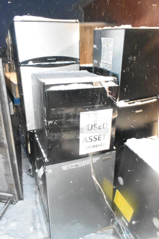 10 used mini coolers including Arctic King ARM32D5ASL, Haier HC17SF10RB, Galanz GL17BK. 115 volts, visible "Used Assets" label.