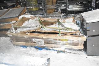 Brand new Anthony door, 29-1/16"x66-9/16", in crate. Packaged securely, snow-covered, with "Used Assets" label visible.