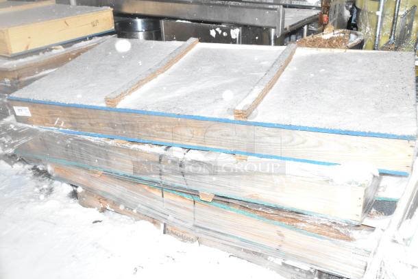 Crated items wrapped in plastic, showing sturdy wooden construction, labeled "E404664." Appears brand new, snowy environment.