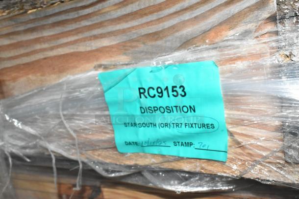 Crated items labeled RC9153, marked "Star South (OR) TR7 Fixtures," new, wrapped in plastic. Date: 10/15/05, Stamp: 701.