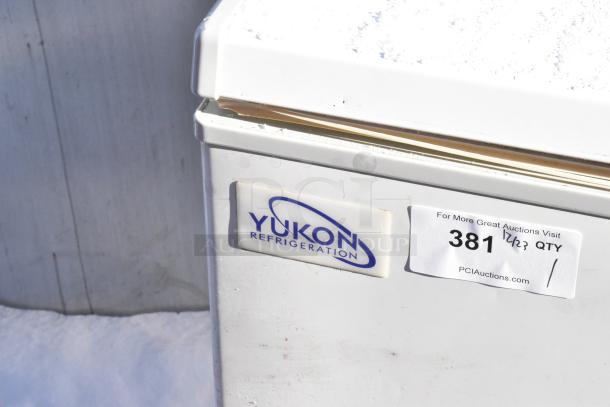 Yukon YCF7 metal chest freezer, 115 volts, 1 phase. Features Yukon Refrigeration logo and auction label with "381".