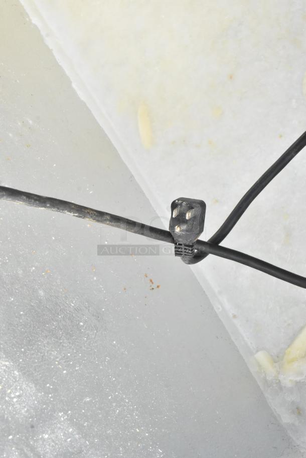 Yukon YCF7 metal chest freezer, 115V, 1 phase. Appears in good condition, features visible electrical cord with a three-prong plug.