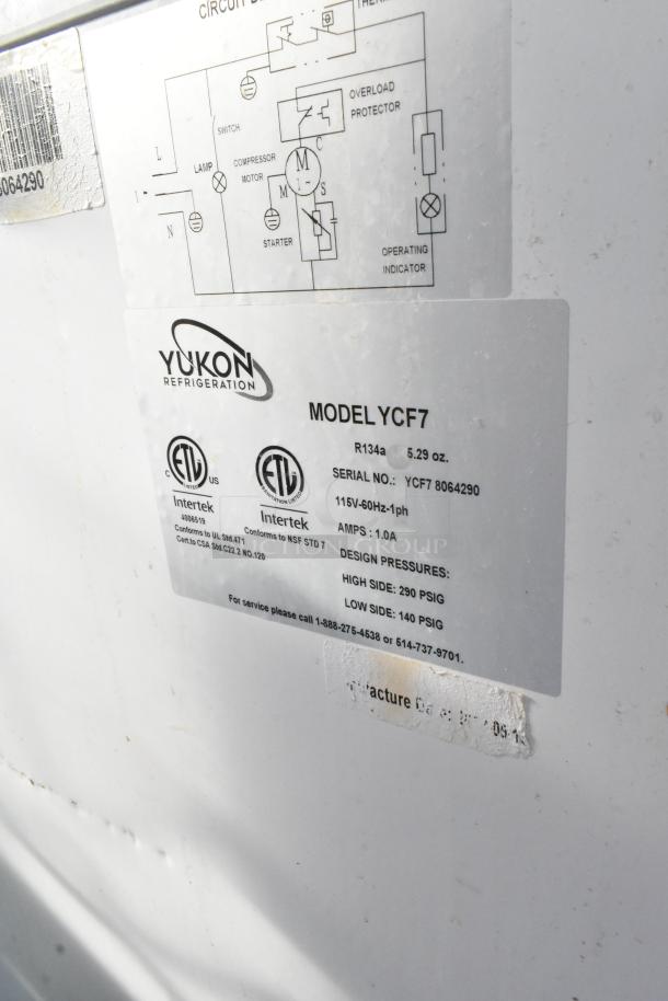 Yukon YCF7 metal chest freezer label. Details include model, serial number, 115 volts, 1 phase, and design pressures.
