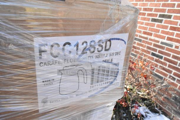 Pallet of FCC12SSD carafes in original packaging, wrapped in plastic. Labels show model and quantity, indicating new condition.