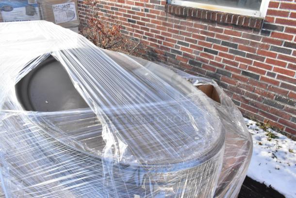 12 new Cambro food pans and storage containers, wrapped in protective plastic, scratch and dent condition.