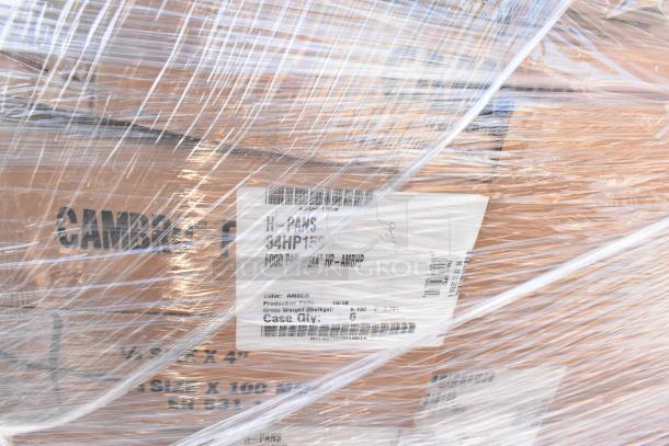 12 Cambro food storage items wrapped for shipping, including full-size translucent pans and round white containers, new condition.