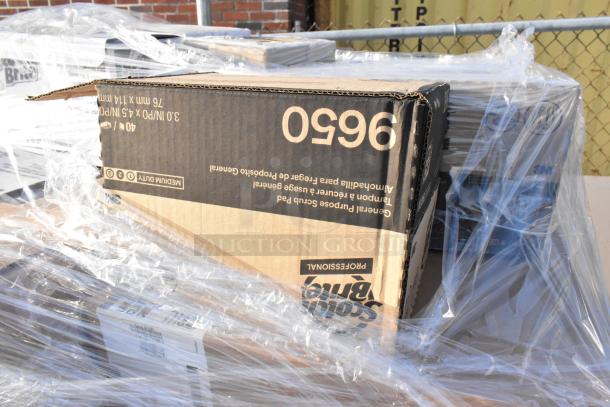 Pallet of 22 new scratch and dent items including Cambro disposable lids and Scot Brite scrubbing pads, wrapped in plastic.