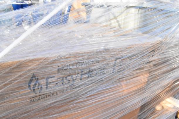 Plastic-wrapped pallet of assorted new "Scratch and Dent" items, including Hollowick's Easy Heat Chafer Fuel boxes with visible labels.