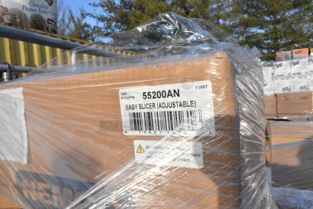 Pallet of brand new items, including Cambro lids, Nemco 55200AN slicer, and Adcraft teaspoons, sealed and labeled for auction.