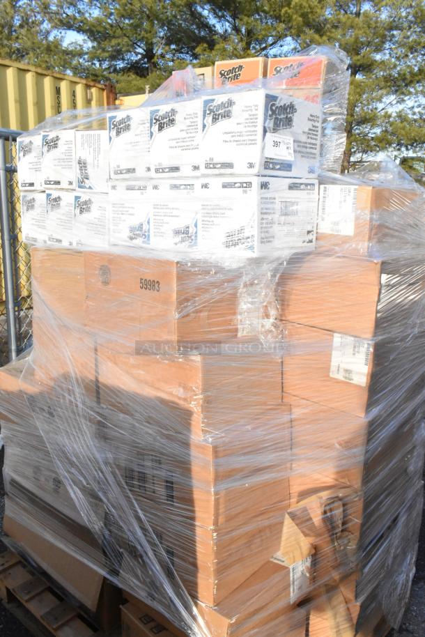 Palette of 32 brand new scratch and dent boxes, including Scotch Brite scrub pads and Cambro clear dome lids, wrapped for auction.