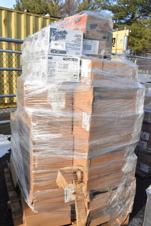 Pallet of brand new scratch and dent items, featuring Scotch Brite scrub pads and Cambro dome lids, wrapped in plastic.