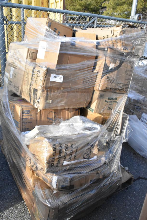 Large stack of scratch and dent boxes wrapped in plastic, containing cold cups, containers, paper towels, lid organizer.