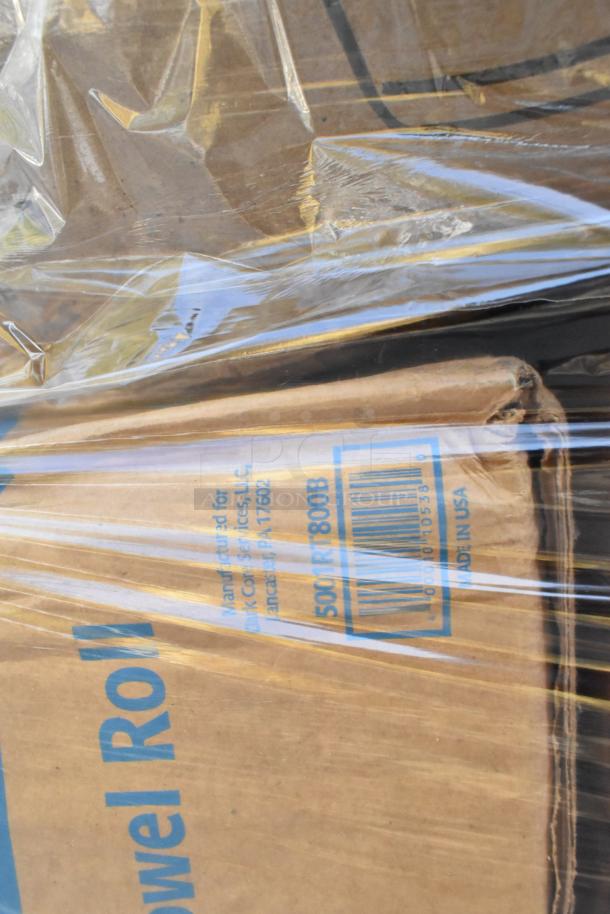 Plastic-wrapped cardboard box labeled "Paper Towel Roll," shows wear. Made for York Services, Lancaster, PA, USA.