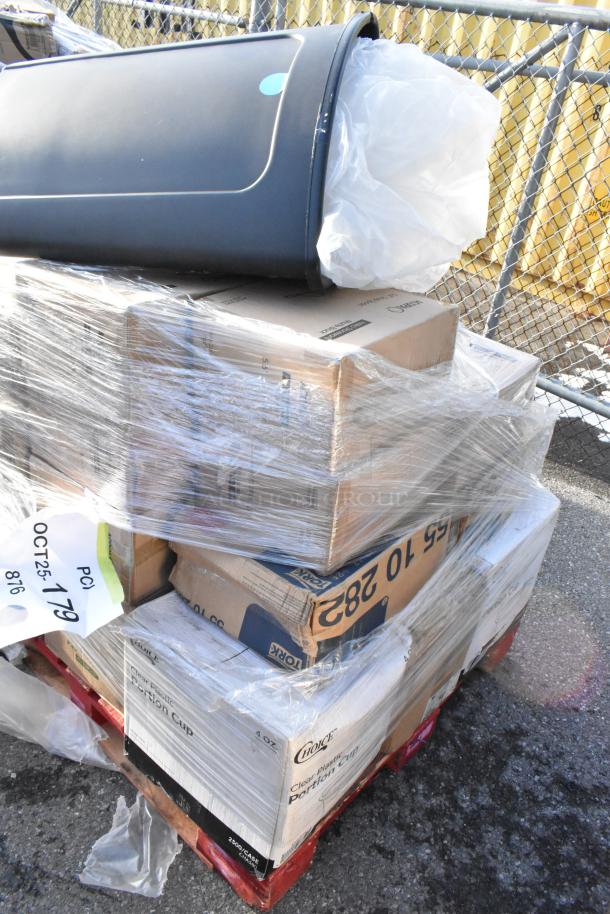 Pallet of 29 scratch and dent items, including strip curtains, tabletop, trash can, wrapped in plastic. Tags read "OCT25 179".