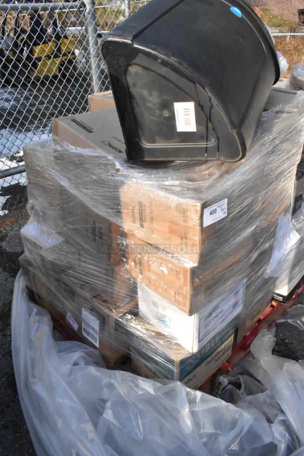 29 new scratch and dent items wrapped on pallet; includes strip curtains, tabletop, trash can. Markings show labels and barcodes.