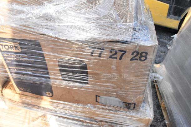 Box of Tork Mechanical Hand Towel Roll Dispensers wrapped in plastic, part of a 20-item scratch and dent auction lot.