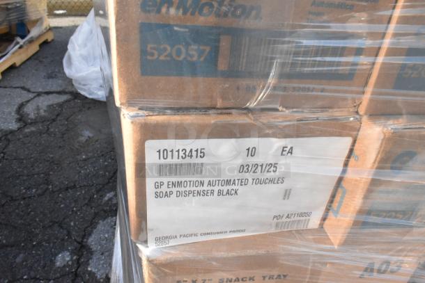 Boxes labeled "GP enMotion Automated Touchless Soap Dispenser Black" in a wrapped pallet. Item code 52057, 10 units each box.