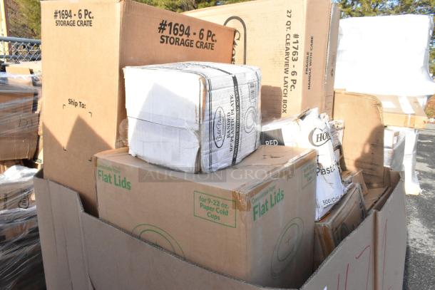 Boxes of new scratch and dent items, including take-out containers, hot cups, and speed rails, labeled for auction.